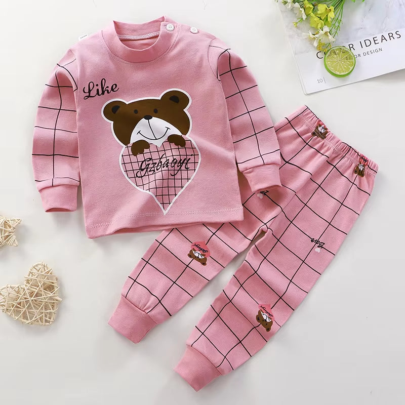 Adorable Kids Pink Bear Fleece Co-ord Set featuring bear graphic sweatshirt and matching checkered pants, perfect for comfort and style.